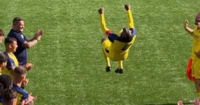 Efe Ambrose performs trademark backflip at guard of honour after former SPFL star calls it quits at Bury