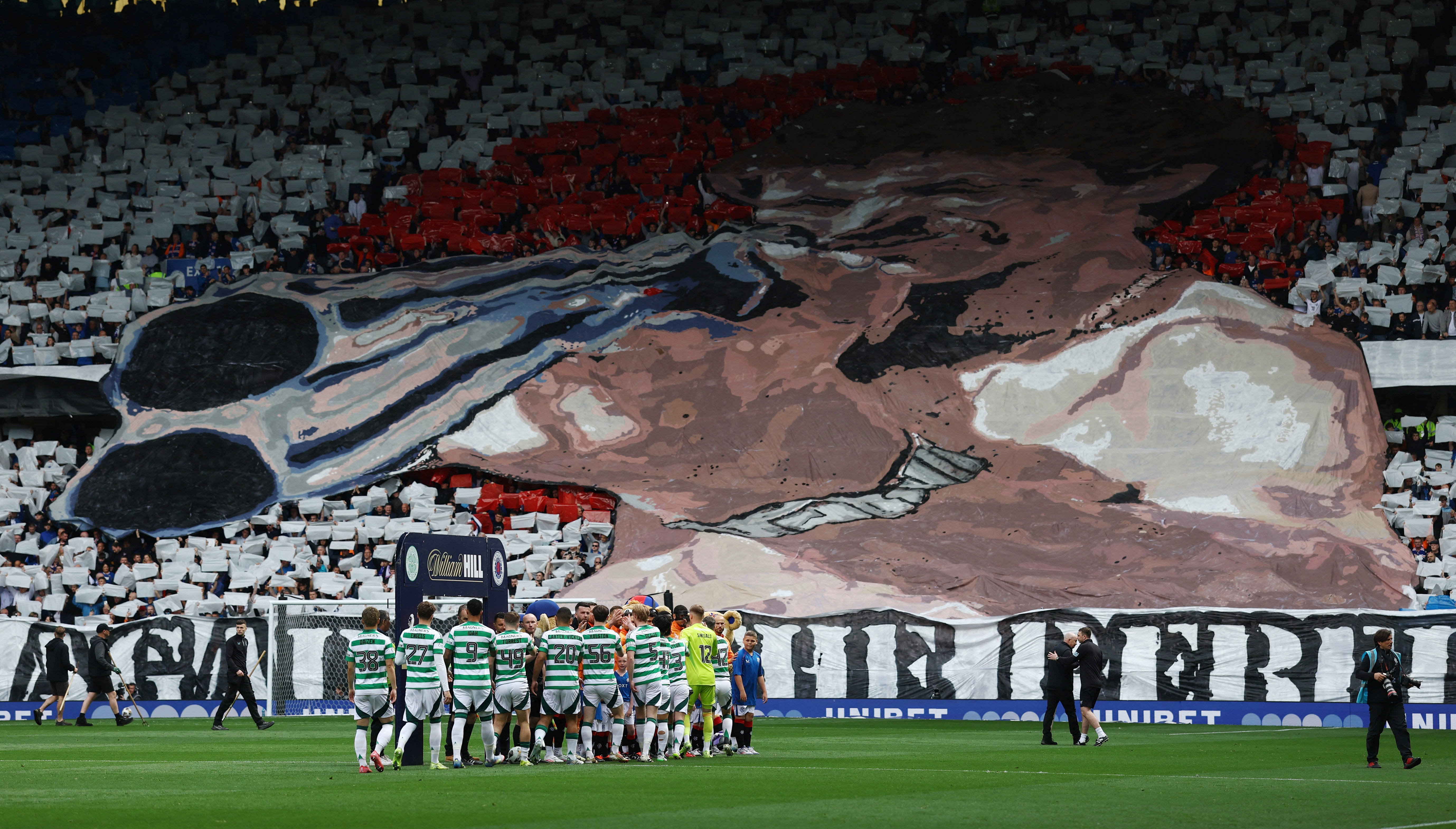 Rangers fans unveil giant ‘rebel scum’ banner with picture of man with shotgun pointing straight at Celtic support
