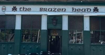 Famous Celtic pub in Glasgow unfurls 8 word banner above entrance in tribute to the champions