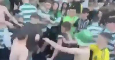 Celtic fans brawl during title party celebrations as supporters take over Trongate