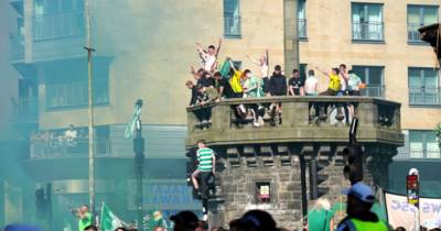 Celtic fans scale ‘unsafe’ historic Glasgow building in title party celebrations