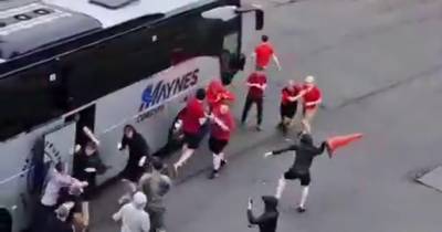 Aberdeen fans in violent brawl with rivals after door opened on supporters bus in Glasgow