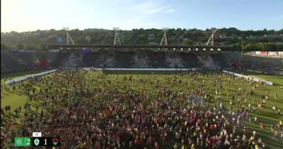 Celtic fans invade Pairc Ui Chaoimh pitch after winning pre-season trophy