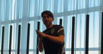 Greg Taylor wows PAOK teammates with ABBA rendition as Celtic hero performs customary initiation song