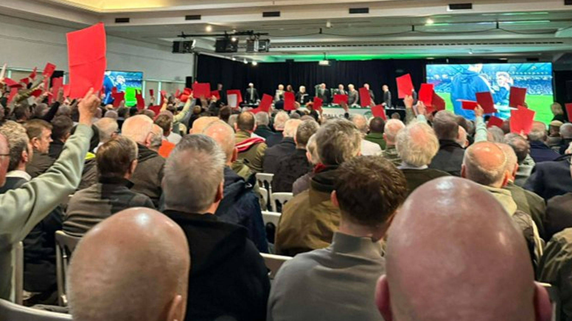 Celtic AGM suspended after just FIVE MINUTES after packed crowd chant ‘sack the board’ and hold up red cards to chiefs