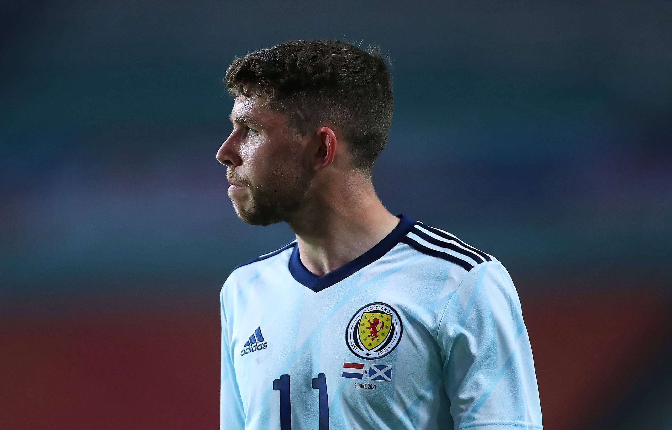 Ryan Christie shows off Celtic jerseys as he reacts to Scotland’s 2026 World Cup draw