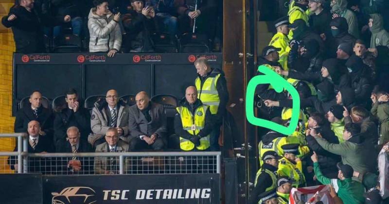 Cops launch manhunt after masked Celtic fan pictured aiming ‘bladed weapon’ at Hoops board