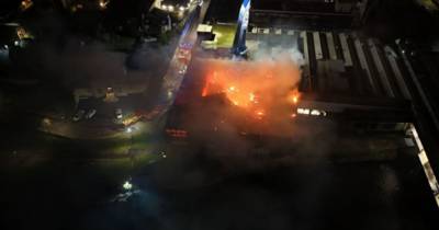 Drone footage shows huge fire tearing through Celtic Supporters Club as shopping centre shut