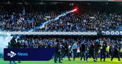 Arrests made as fans clash on Ibrox pitch after Celtic knock Rangers out of cup