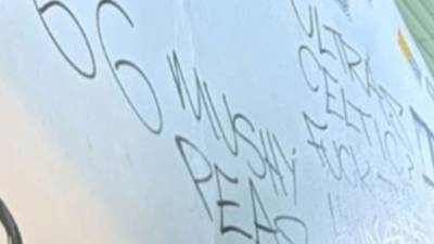 Celtic fans scrawl sick graffiti mocking victims of Ibrox disaster across Broomloan Stand during Rangers clash
