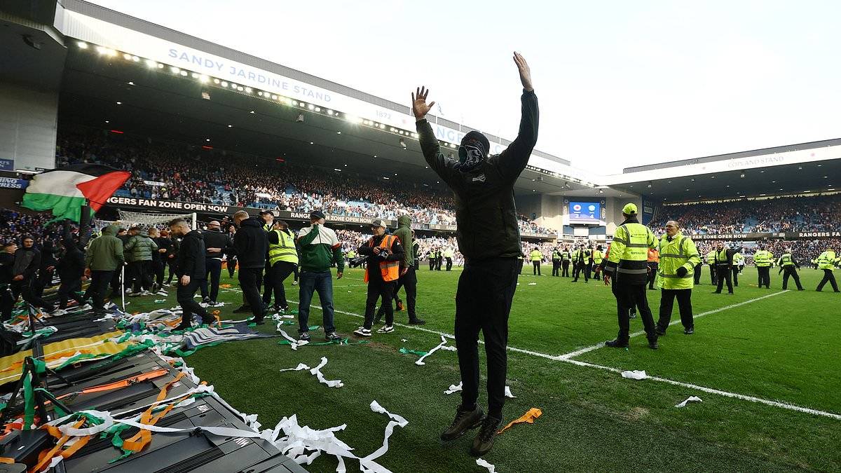 Chaos unfolds in the O** F*** derby as police are forced to separate Celtic and Rangers supporters following pitch invasion at the end of dramatic Scottish Cup tie