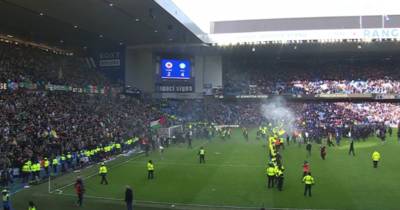 Celtic member of staff ‘attacked’ amid ‘lunatic’ scenes as Rangers Scottish Cup clash descends into pitch invasion chaos