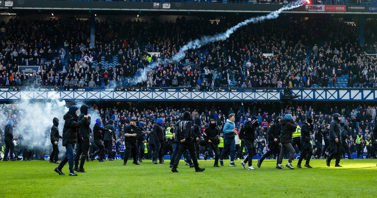 Cops blast ‘shameful’ Rangers v Celtic pitch invasion scenes as officers and stewards injured