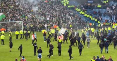Rangers fans storm pitch as flares thrown after Celtic penalty shootout chaos