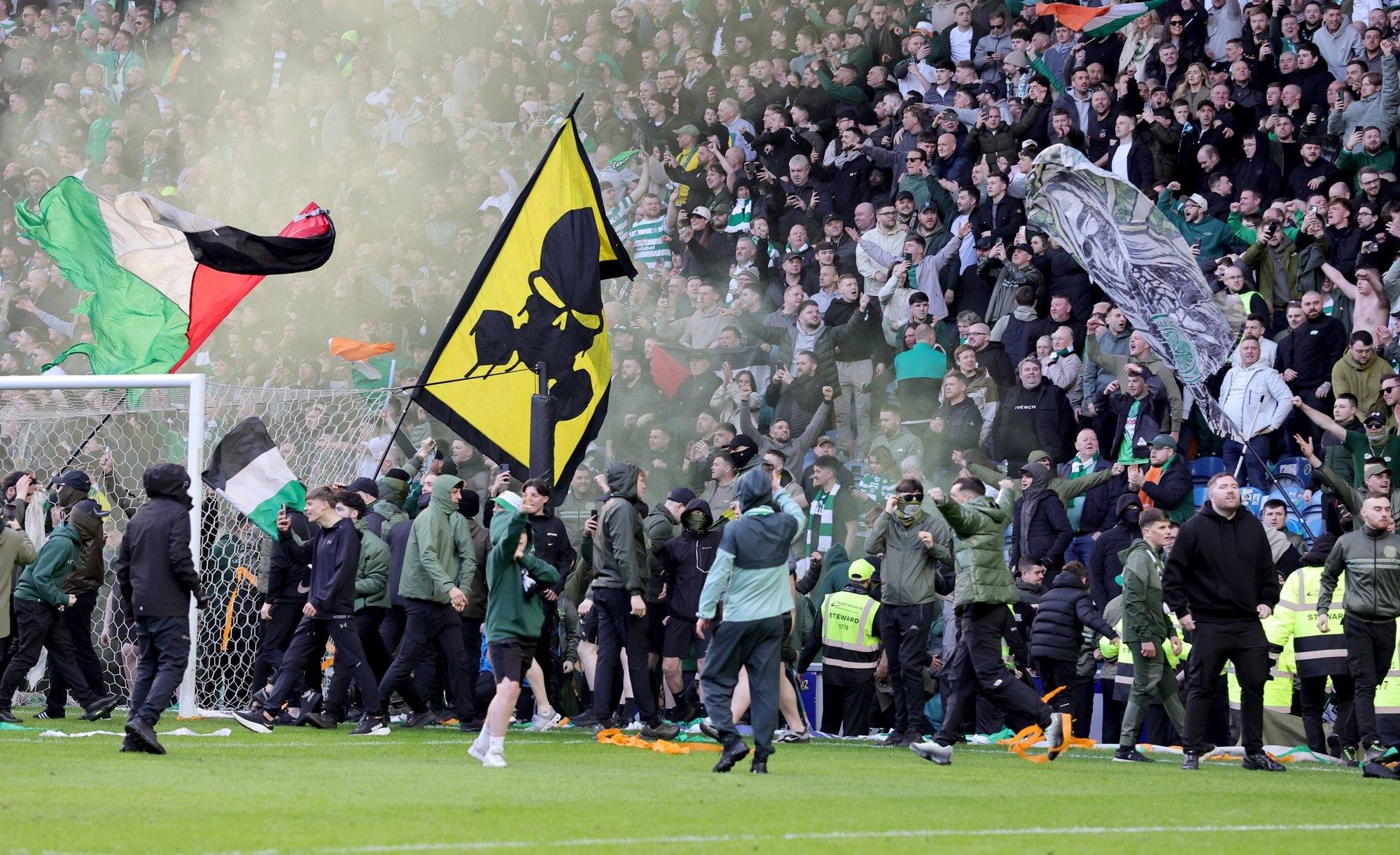 Celtic and Rangers fans clash as Ibrox pitch invasion mars Scottish Cup tie