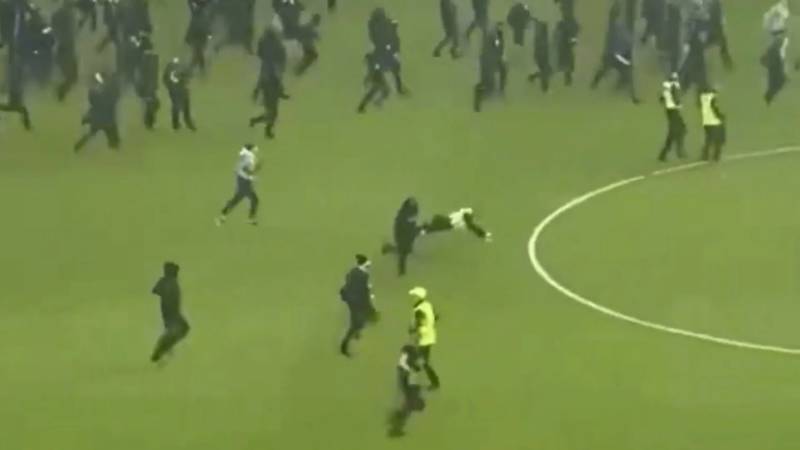 Shock moment Rangers fan KICKS police officer to the ground amid O** F*** carnage