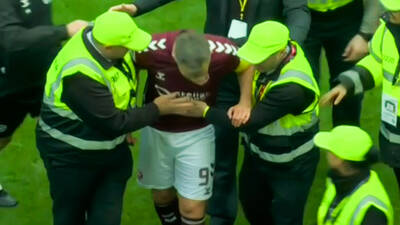 Lawrence Shankland appears to be ‘punched’ as Celtic vs Hearts title clash descends into chaos