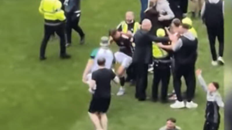 Moment Hearts star ‘stamps on Celtic pitch invader’s phone after being confronted by yob in chaotic scenes’
