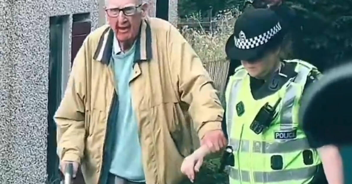 “Burn in hell” Celtic Boys Club paedo Frank Cairney brandishes walking stick at men during protest at home
