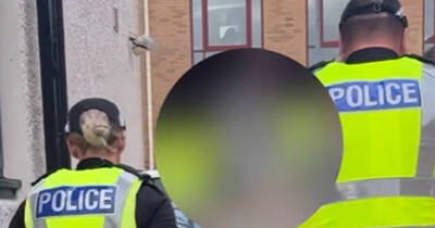 Cops storm home with battering ram amid raids as three arrested after Celtic title party Cops storm home with battering ram amid raids as three arrested after Celtic title party