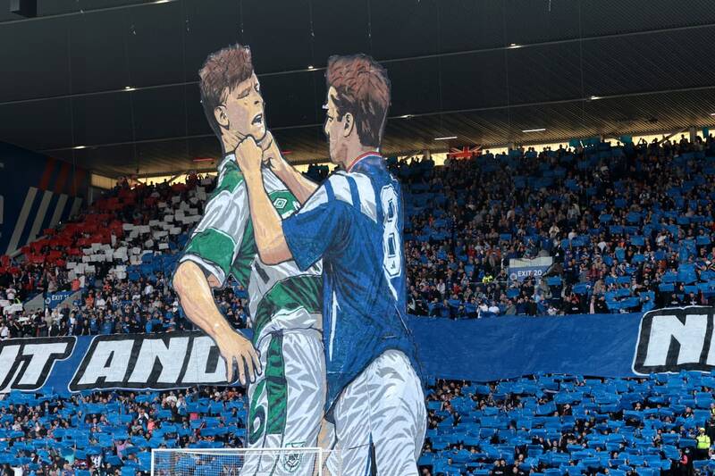 Rangers listen to bullish fans’ graphic Celtic message as Umbro ad hoarding moment says it all