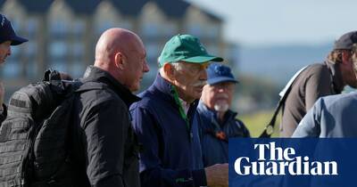 Celtic fans throw tennis balls at club owner Dermot Desmond during golf tournament