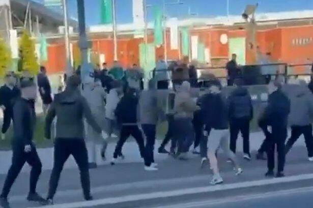 Celtic and Hearts fans throw punches in shocking mass brawl outside stadium ahead of league clash