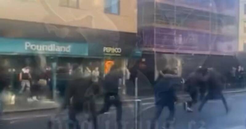Mob race through city centre as man struck by bottle in pre-match clash
