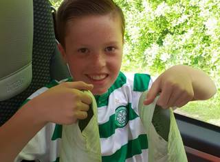 Young Celtic Fan Poses With Leigh Griffiths Boots After Striker’s Gift Young Celtic Fan Poses With Leigh Griffiths Boots After Striker’s Gift